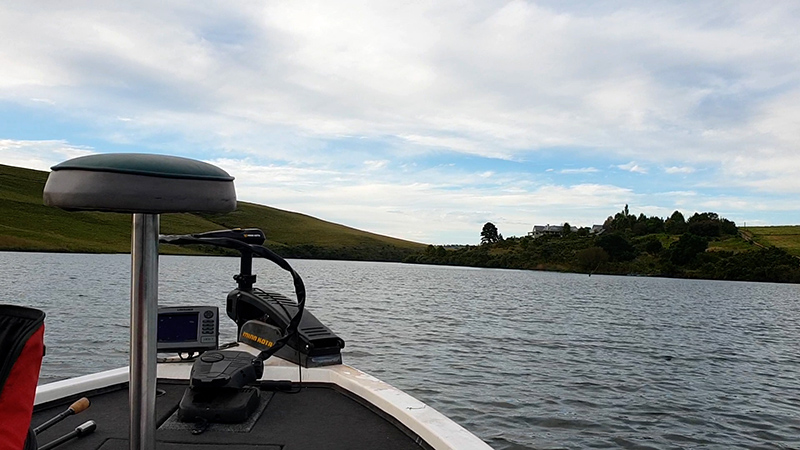 Bass boat cruising on Mearns Dam