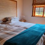 Bedroom in cabin at Stanford Lake Lodge